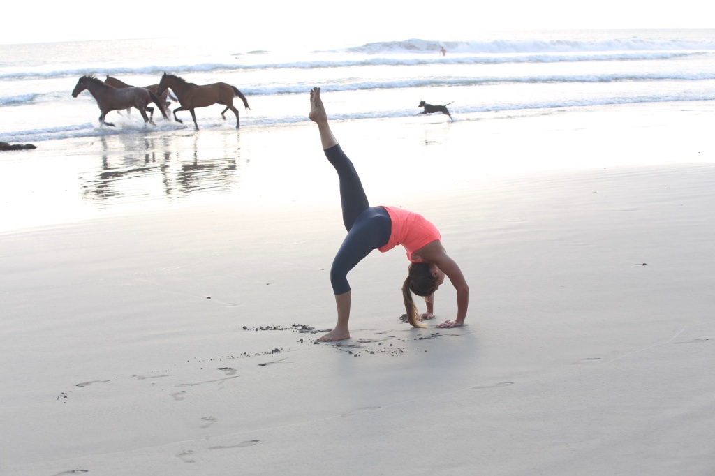 Alana Roach experiencing FREEDOM! Wild Horses on in Santa Teresa, Costa Rica with lancelaurence.com